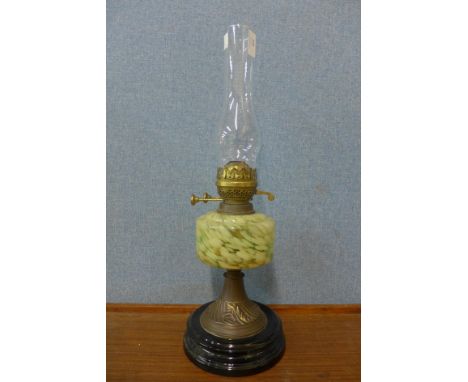 A Victorian brass and green glass oil lamp 