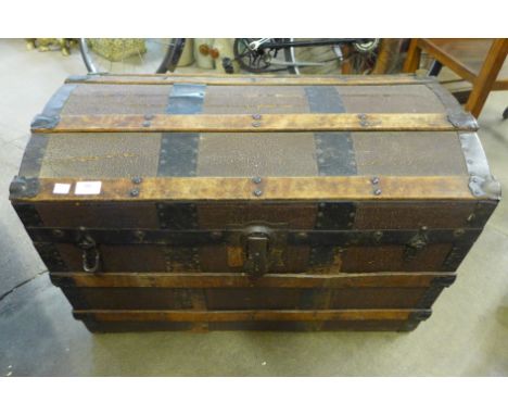 An early 20th Century dome topped steamer trunk 