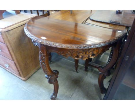 A French style carved hardwood demi-lune console table 