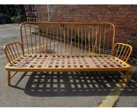 A retro Ercol Windsor three seater sofa, no cushions 