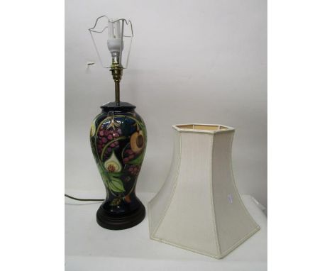 Emma Bossons design for Moorcroft pottery, a Queen's Choice pattern table lamp of inverted, baluster shape, raised on a circu