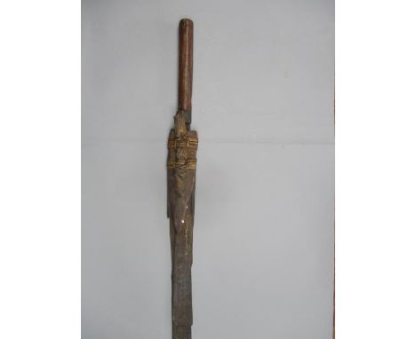 A late 19th/ 20th century Malaysian Bolo type short machete with part of the wooden scabbard tied with a cane blade, 19" l, 3