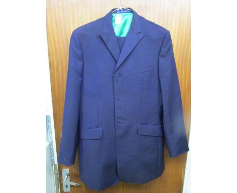 A Bespoke Couture Ozwald Boateng designer gentleman's suit in navy blue, the jacket with two tone green silk striped lining a