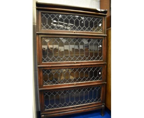 A Globe Werncike four tier bookcase, with leaded glass doors
