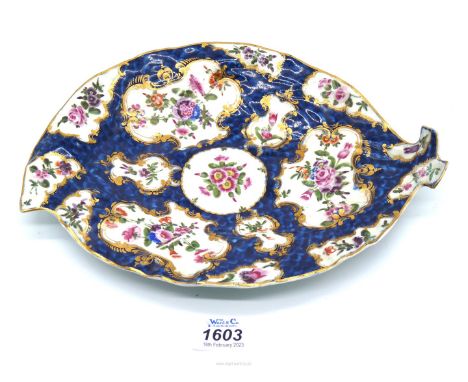 A Worcester leaf form dish c. 1770, painted with panels of flowers against a blue scale ground; faux Chinese seal mark to bas