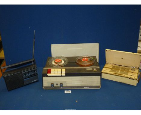 A vintage Philips reel to reel tape recorder, a Panasonic radio and an Eveready radio in bakelite case.