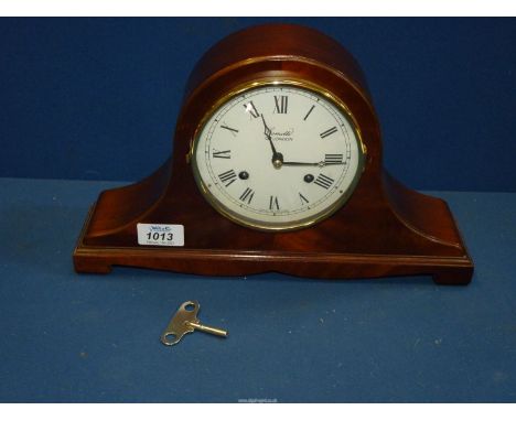 A Comitti of London Mahogany Napoleon's hat form mantel Clock having a white face with Roman numerals, with key - keeps good 