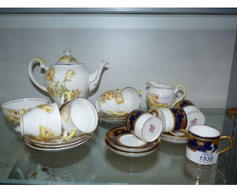 Four Mintons coffee cans and saucers decorated in cobalt blue and gold, pattern No. G9910 to base. Together with a Salisbury 