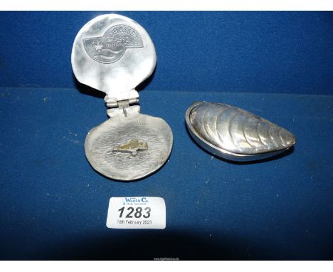 A Shell made from metal depicting the Cohasset 1992 First Offshore oil, which was Canada's first offshore oiul project produc