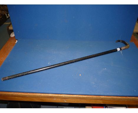 An Ebony Walking Stick having a horn handle.