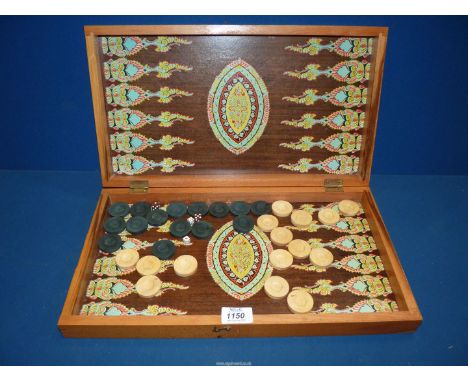 A colourful Backgammon Box with oriental theme including fifteen black and white counters and four dice.