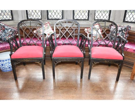 A surprisingly heavy Trio of Chinese Chippendale design Elbow Chairs having black lacquered finish with polychrome stylised f