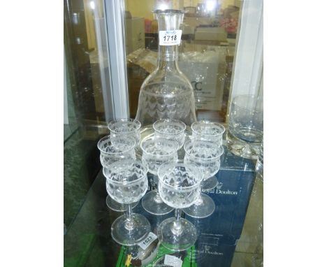 An etched glass bell shaped Carafe with swag detail, 9 1/2" tall and eight liquor glasses (some with minor chips).