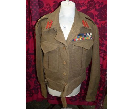 An Austin Reed of Regent Street, khaki Military battle dress Jacket having a formation shoulder patch for the 19th Indian div