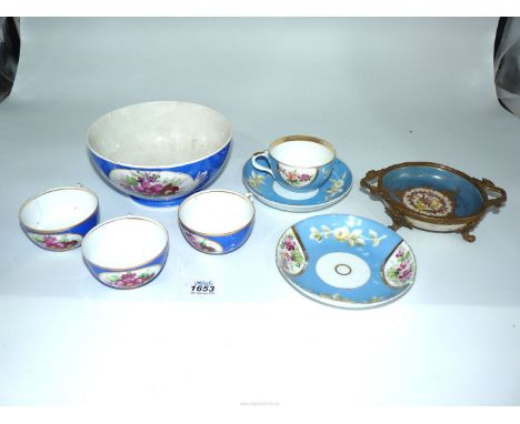 Three vivid blue porcelain cups made in Russia and a large slop bowl/sugar bowl to match, together with two pale blue porcela