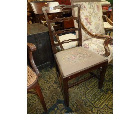 A Georgian style Mahogany framed side Chair having pierced ladder back, the drop-in seat decorated with stylised flower bloom