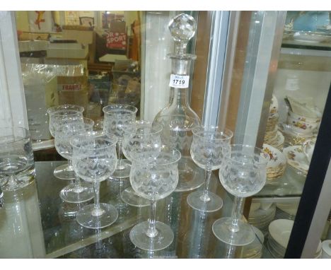 An etched glass bell shaped Carafe with swag detail, 9 1/2" tall (with non-matching stopper) and eight stemmed port/wine glas