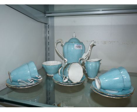 A Royal Standard coffee set in mottle light blue comprising of; coffee pot, sugar bowl, cream jug and 6 cups &amp; saucers.