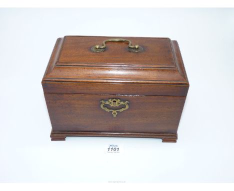 A good George II/ early George III Mahogany three compartment tea caddy with a cavetto cover and fret cut brass escutcheon, 9
