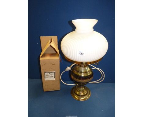A brass Oil Lamp with opaque glass shade converted to electric but with a wick fitting for converting back.