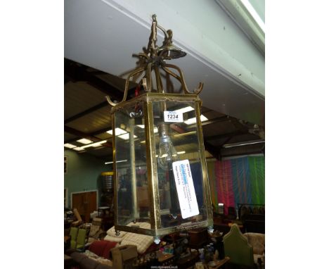 A hexagonal six pane Brass framed Hall Lantern light fitting with hanging rose and bulb, 9'' diameter x 16 1/2'' high.