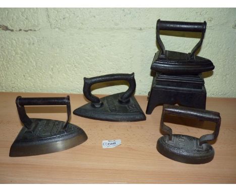 A group of four Irons including No. 12 Flat Iron mark indistinct R. K.., Salter No. 5 Military Flat Iron mark with arrow 1953