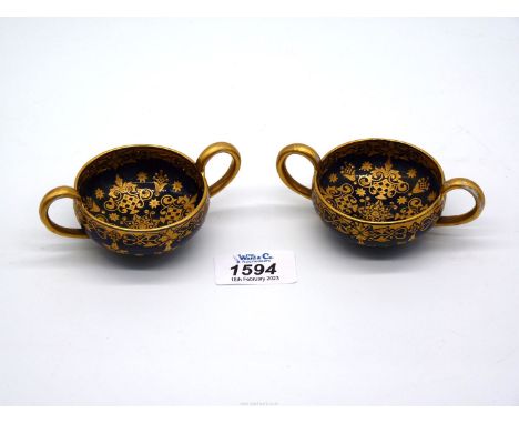 A pair of Coalport 2 handled quaiche cups with rich gilt decoration on a blue ground.