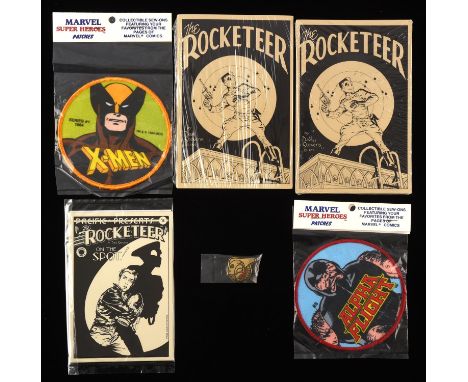 The Rocketeer by Dave Stevens -  a collection of sealed postcard packs, enamel pin and additional X-Men patches (Pacific Comi