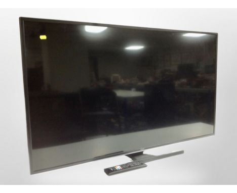 A Hitachi 50 inch LCD TV with lead and remote 