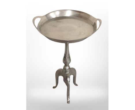 A chrome tripod table, height 65 cm 