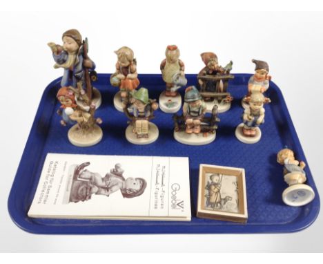 A group of Hummel figures.