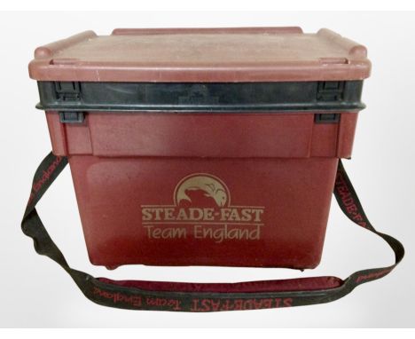 A Steade-Fast fishing box containing assorted fishing equipment including reels, line, lures, tools, etc., together with a re
