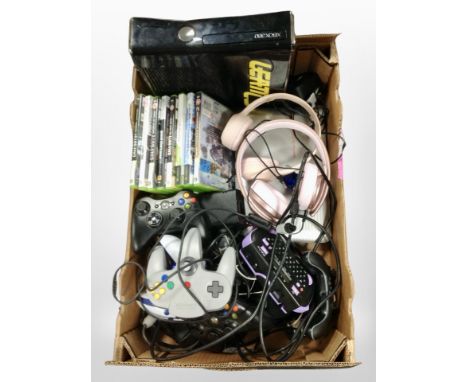 A box containing Xbox 360 console, assorted games, controllers, headphones, etc.