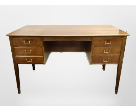 A mid 20th century Danish walnut writing desk fitted six drawers, width 127 cm 