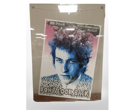 A Bob Dylan poster in perspex frame, 80cm x 58cm overall.