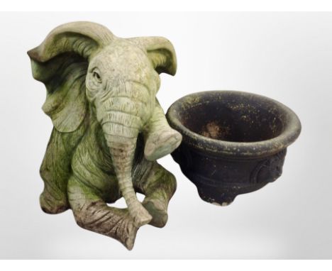 A plastic elephant garden ornament, height 49 cm, and a further concrete planter 