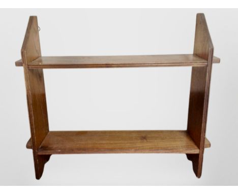 An Edwardian oak wall shelf, width 50 cm 