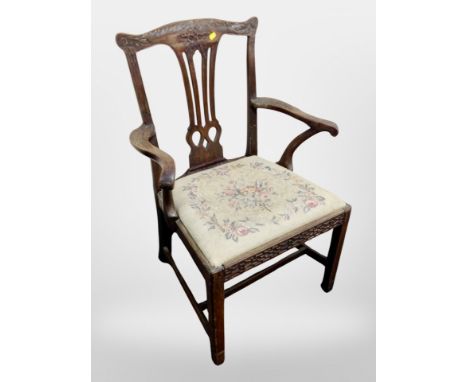 A 19th century carved armchair in the Chinese Chippendale style with tapestry drop-in seat 