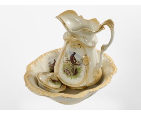 A Victorian wash jug and basin and matching dressing table pot decorated with pheasants.