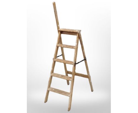 An early 20th century folding pine step ladder 
