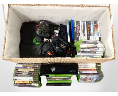 A wicker hamper containing an Original Xbox 360 console and assorted games.