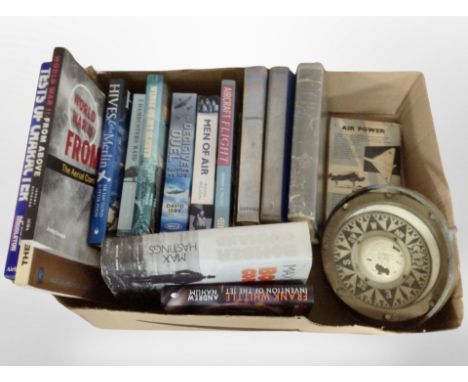 A box of volumes relating to air combat and the RAF, together with a early 20th century brass ship's compass.