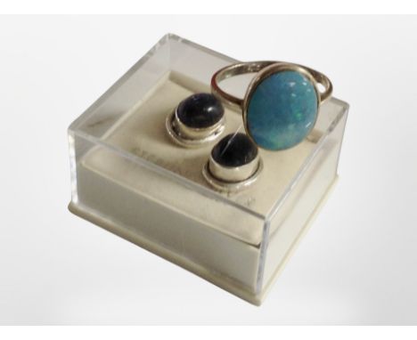 A pair of stirling silver earrings and a silver and opal ring.