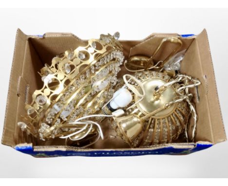 A box of 20th century brass pendant light fittings.
