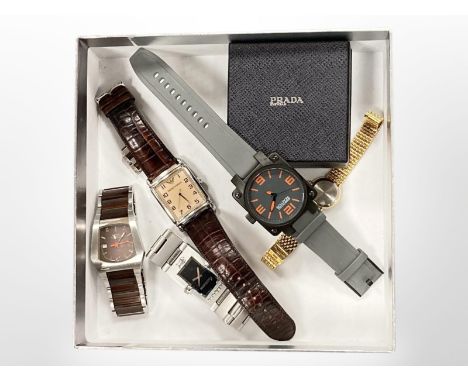 A collection of watches to include Kenneth Cole, Emporio Armani etc, Prada paperweight