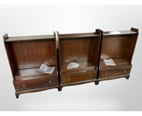 Three Stag Minstrel open bookcases fitted with drawers beneath, each 75cm wide.