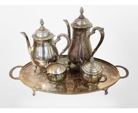 A silver-plated four-piece tea service on twin-handled tray.