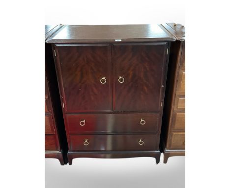 A Stag Minstrel double-door cabinet with drawers beneath, width 82cm.