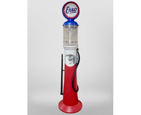 A plastic sweet dispenser in the form of a Esso petrol pump, height 226cm.