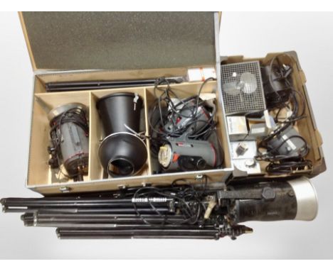 A crate and box containing stage lighting, tripods, camera filters, etc.